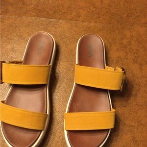Mia yellow platform slip on sandals.